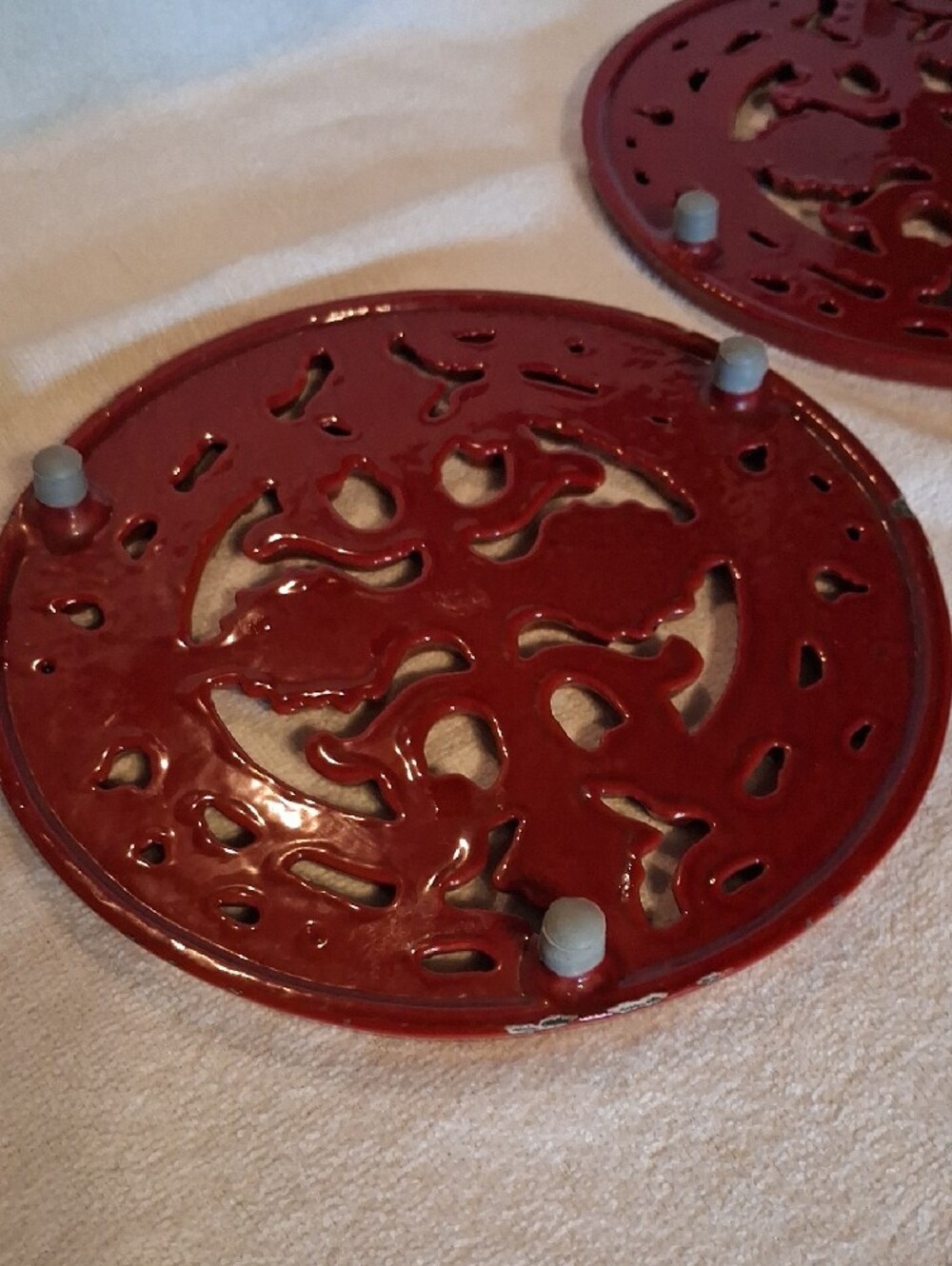 Staub Red Decorative Cast Iron Enameled Trivet Pair - Picture 2 of 5